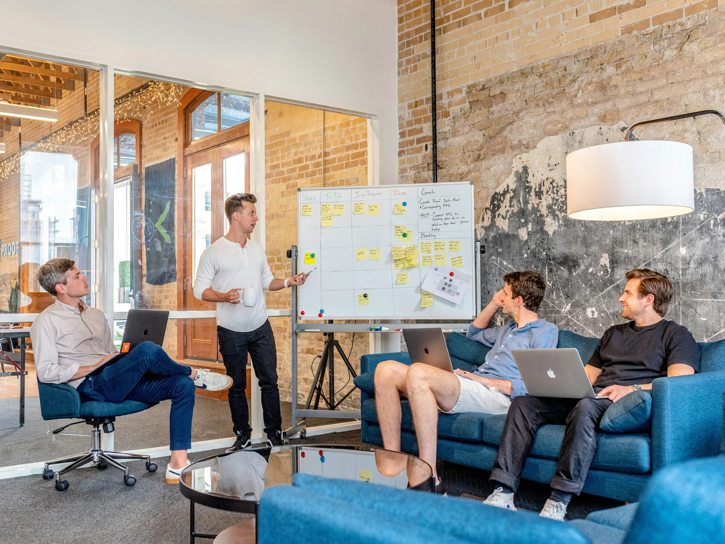A team reviewing website project priorities on a whiteboard